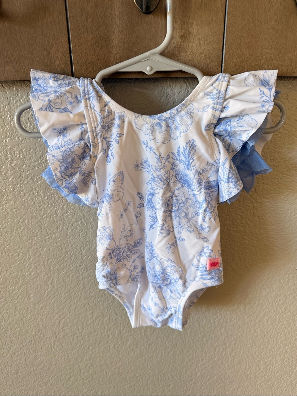 RuffleButts White Swimsuit with Blue Floral Print